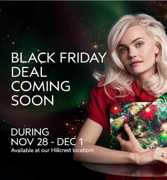 A woman with platinum blonde hair holds wrapped gifts. Text reads: 'Black Friday deal coming soon. During Nov 28 - Dec 1. Available at our Hillcrest location!. - Gila Rut Salon | San Diego and Chula Visa, CA