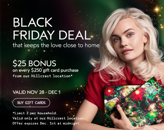Woman holding wrapped gifts with text promoting a Black Friday deal: $25 bonus for every $250 gift card purchase at Hillcrest location, valid Nov 28 - Dec 1. - Gila Rut Salon | San Diego and Chula Visa, CA